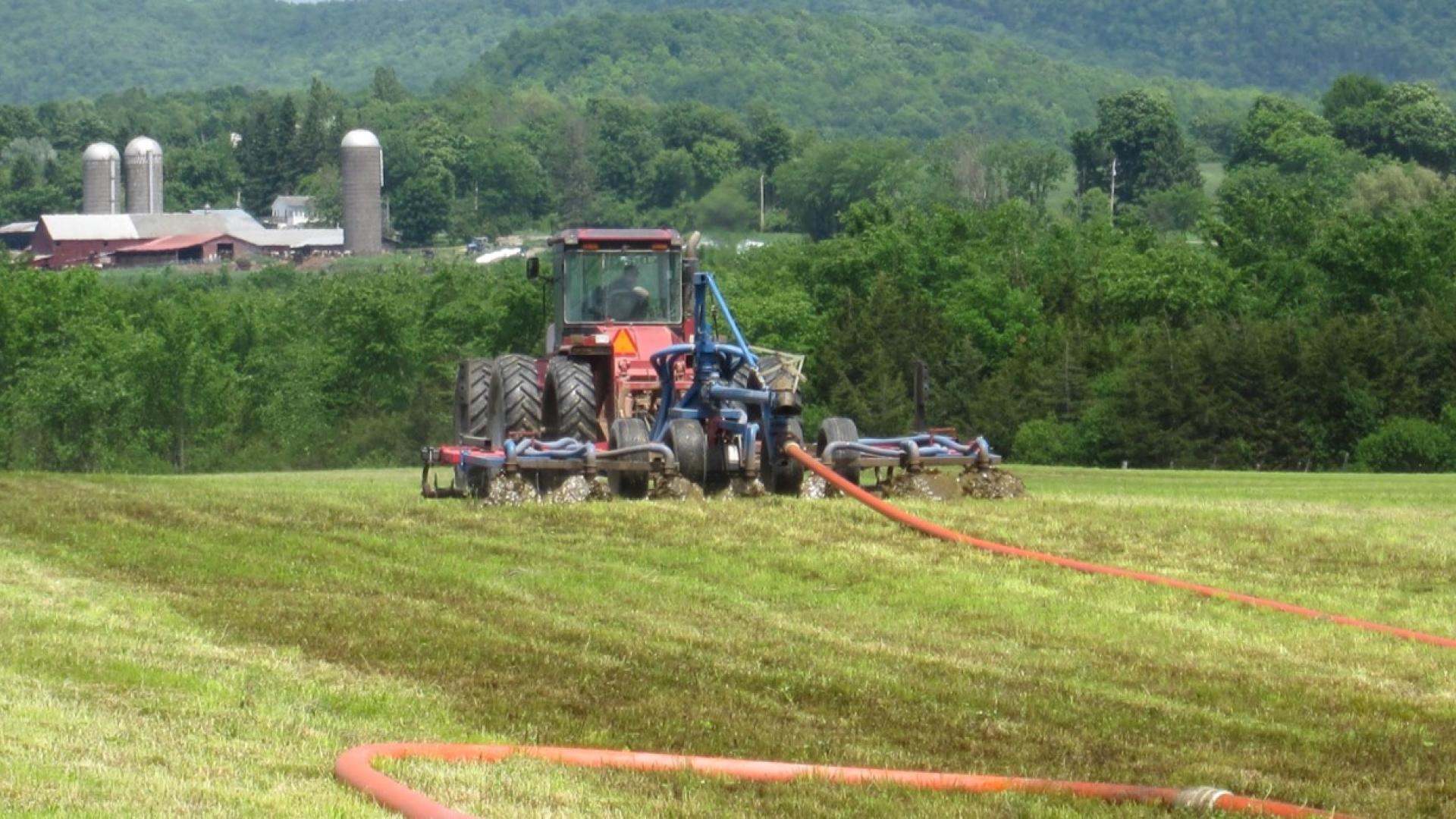 Manure spreader in field