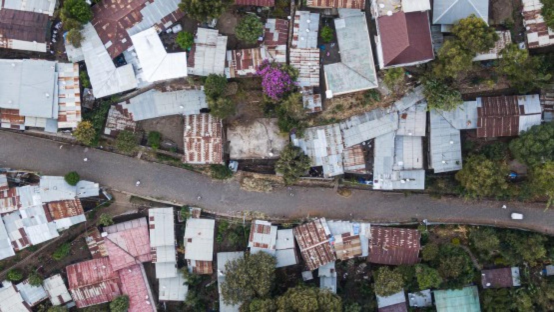 birds-eye-view of a city road with buildings on either side.