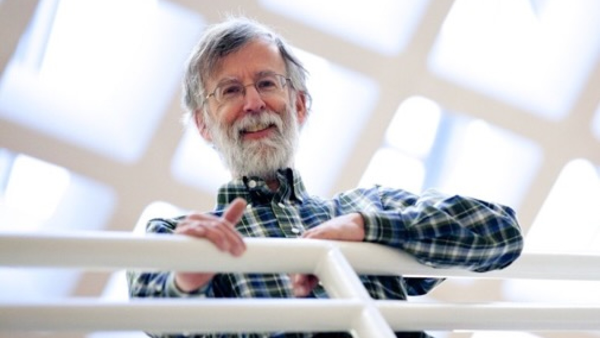 Andy Clark leaning on a white railing