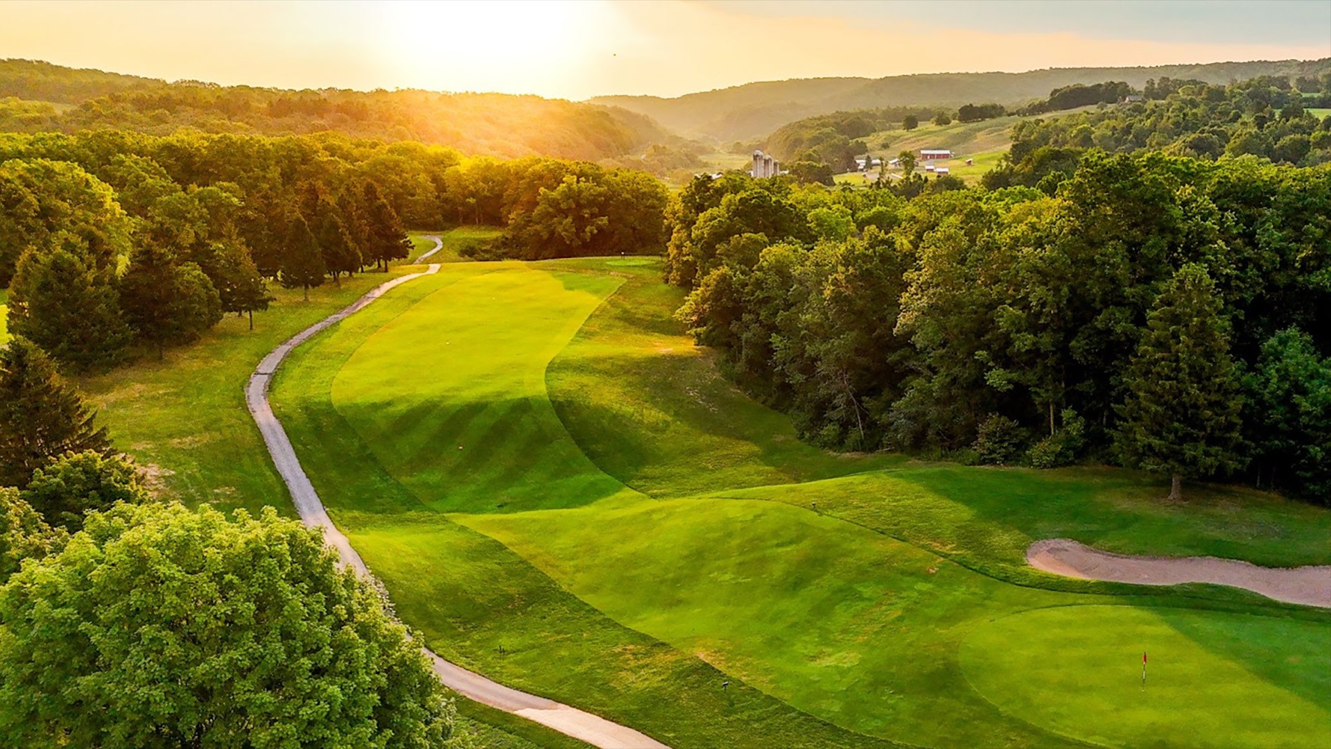 aerial view of fairway with rising sun
