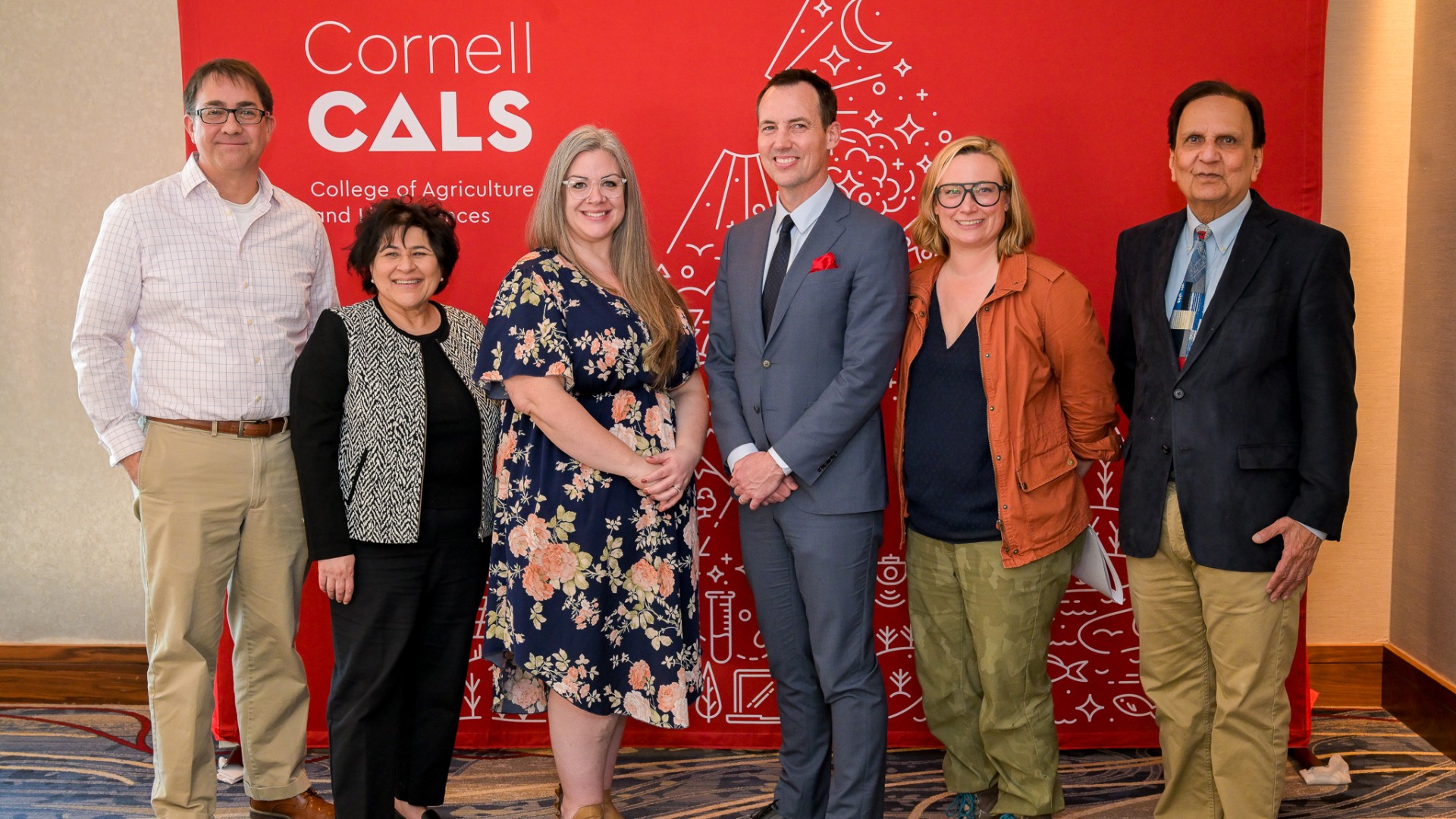 Dean Houlton poses with awardees at the Faculty and Staff Awards ceremony