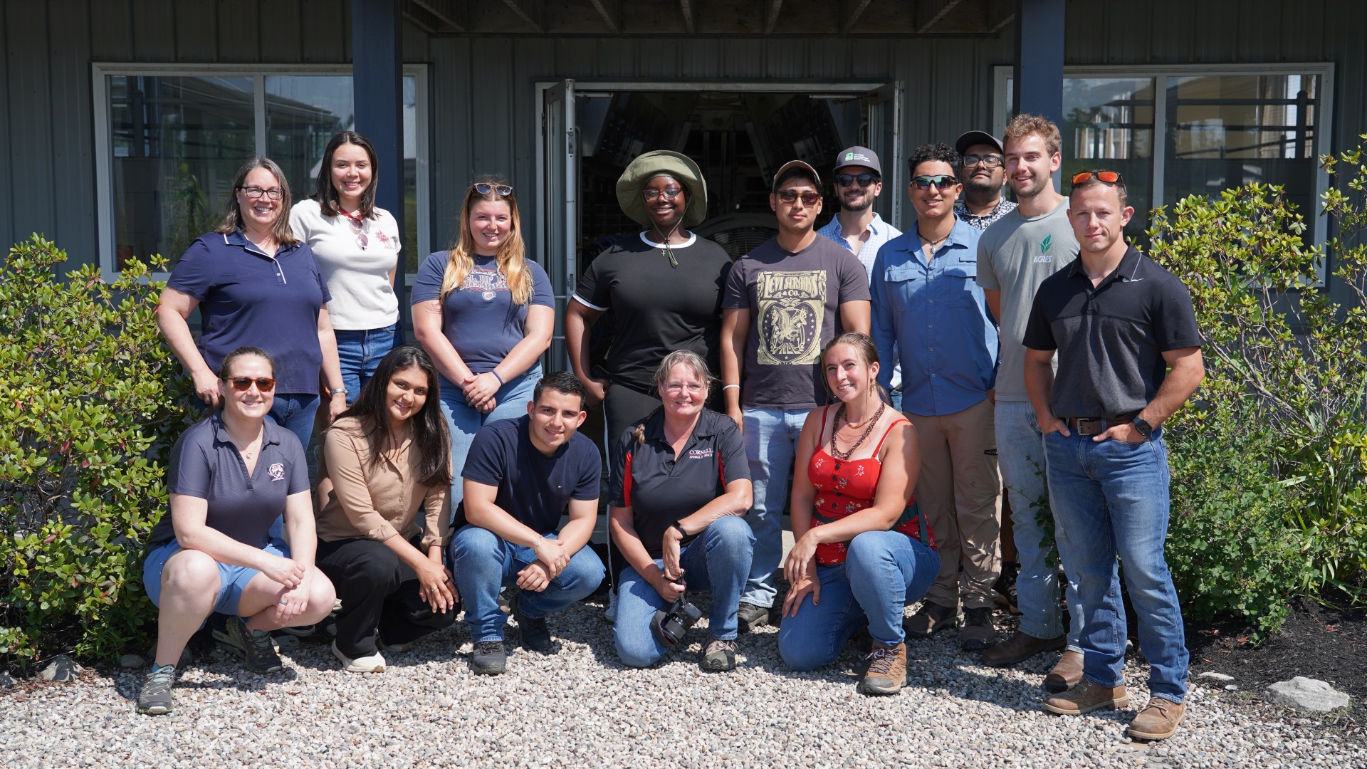 A group of people stand together in front of the facility at the Miner Institute.