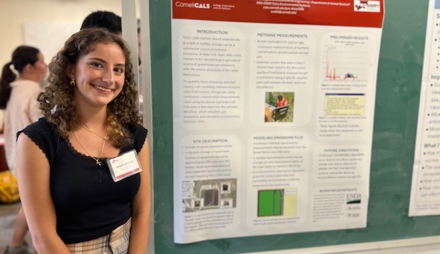 person standing by a science poster