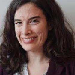 Headshot of a woman with long dark hair