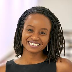 portrait of a woman with brown hair and a black dress