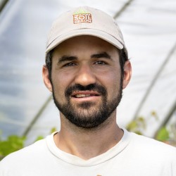 amsili headshot with soil health program cap