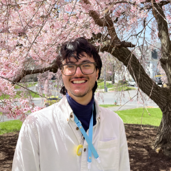 Ben Basem in front of flowering tree