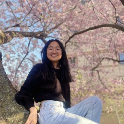 Woman with dark hair and glasses