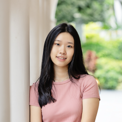 woman in pink shirt with dark hair