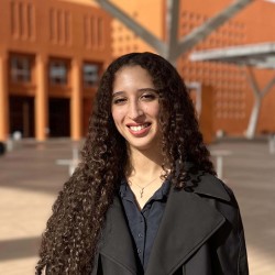 Photo of a person standing outside