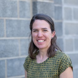 woman standing in green shirt