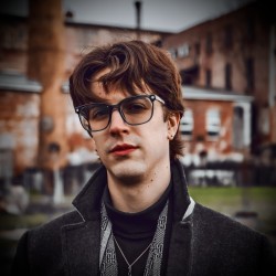 A headshot photo of Henry Zelenak