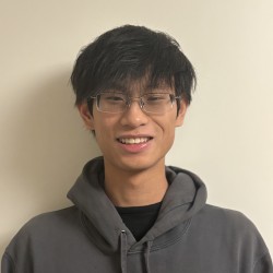 Man with glasses and grey shirt