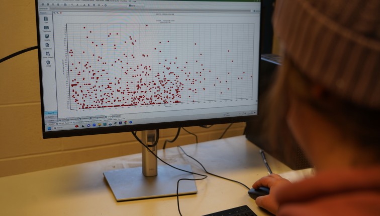 a computer screen with data recorded as red dots