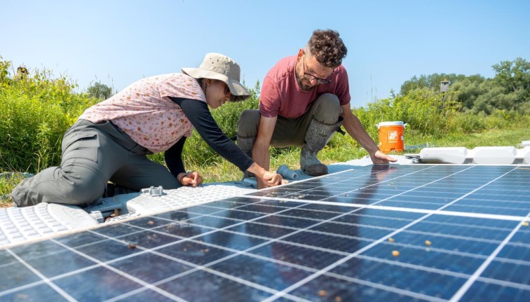 Solar panel-topped ponds under construction at the Cornell Experimental Pond Facility. 
