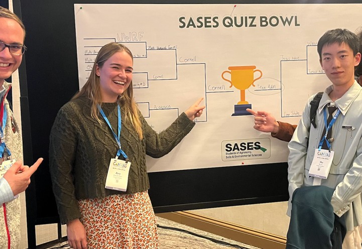 crop judging team with bracket board