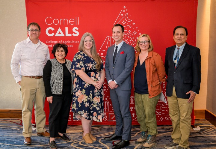 Dean Houlton poses with awardees at the Faculty and Staff Awards ceremony