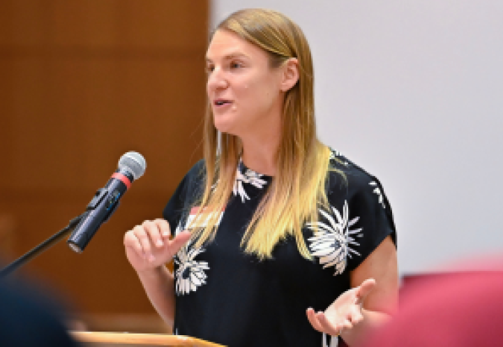 Margaret Frank speaking at an event