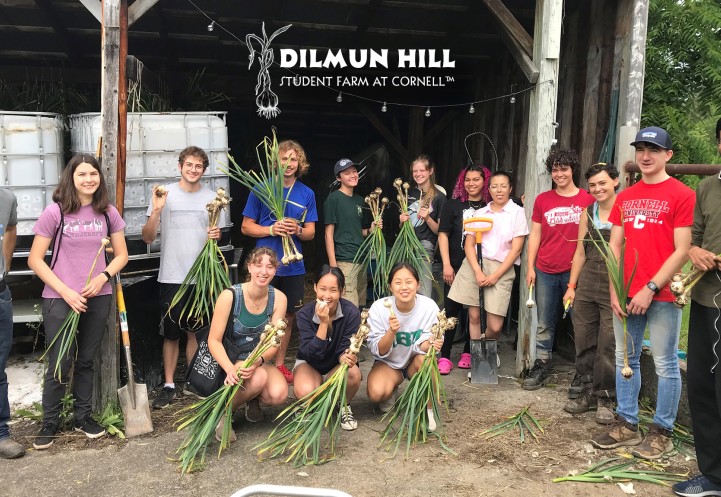 A diverse group of students with fresh garlic