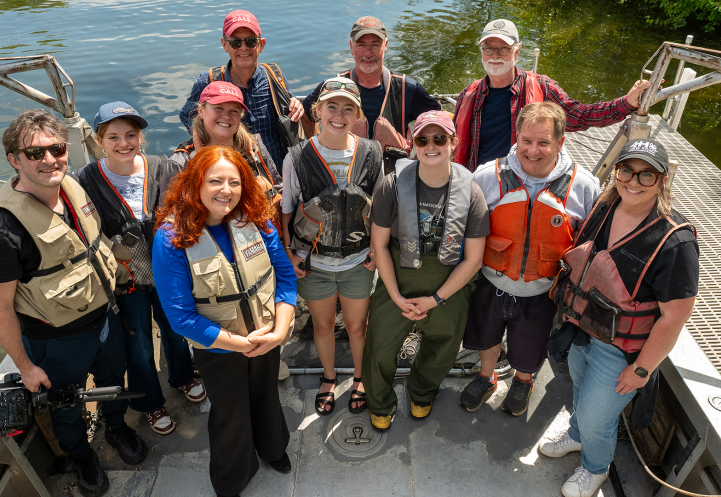 CCE staff, summer interns all wearing lifejackets - like good boaters should.