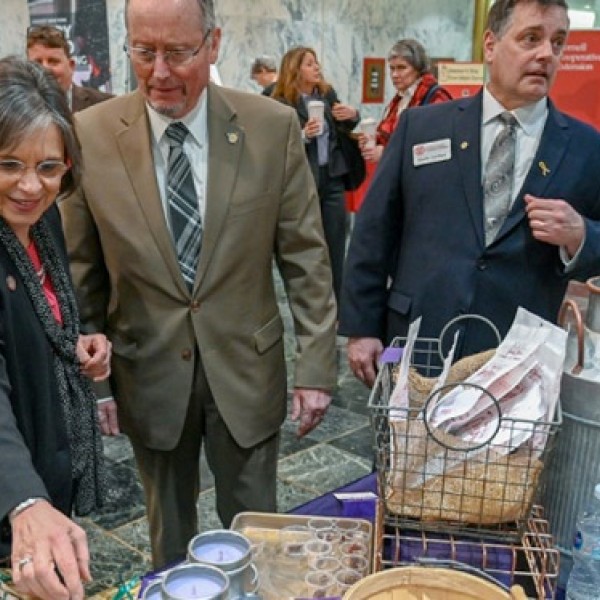 Donna Lupardo, Richard Ball and Kevin Jordan sample products at the Taste NY table