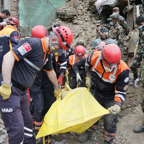 Rescue workers recover bodies after an April 2015 earthquake in Nepal