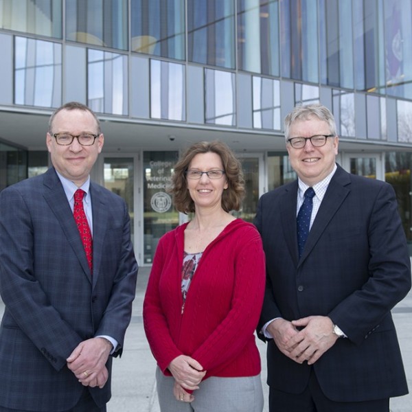 Kevin F. Hallock, Jodi Korich and Lorin D. Warnick outside the College of Veterinary Medicine