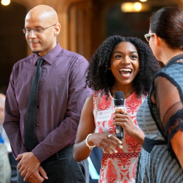 Student, Professor, and High School presenting during luncheon