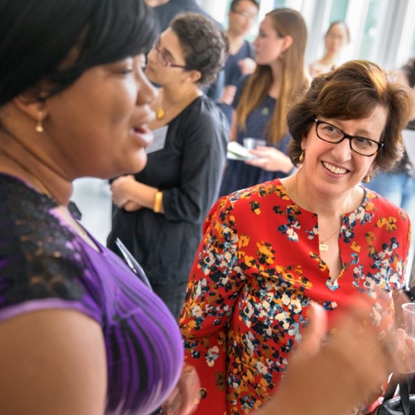 Martha Pollack listens to a student present