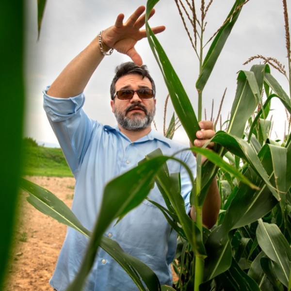 Mike Gore with corn stalks
