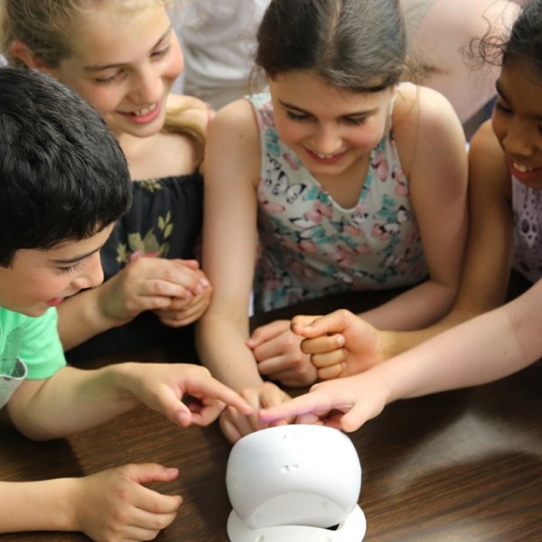 Students play with an air quality egg