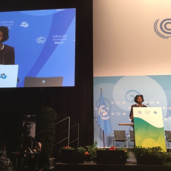 Etinosa Obanor stands at a podium