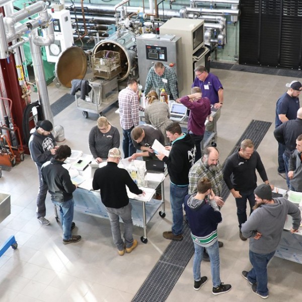 Cider makers gather in a lab