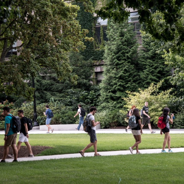 Students walk across quad