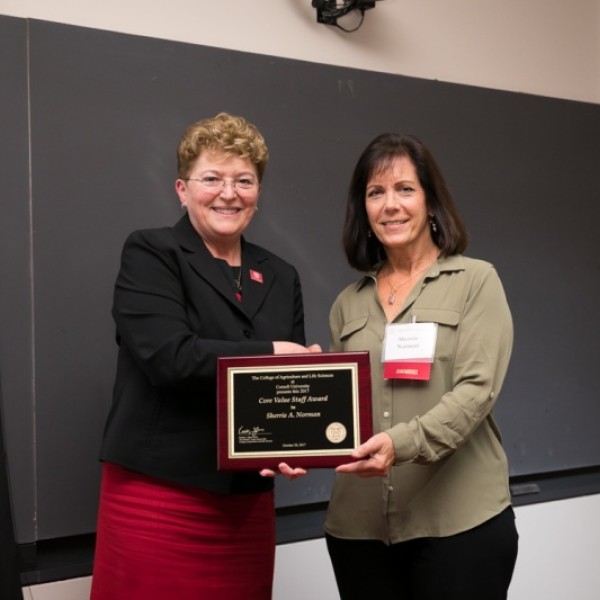 Dean Boor shakes hands with Norman