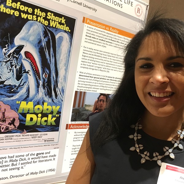 Alexis Cousins-Culver standing in front of her research poster