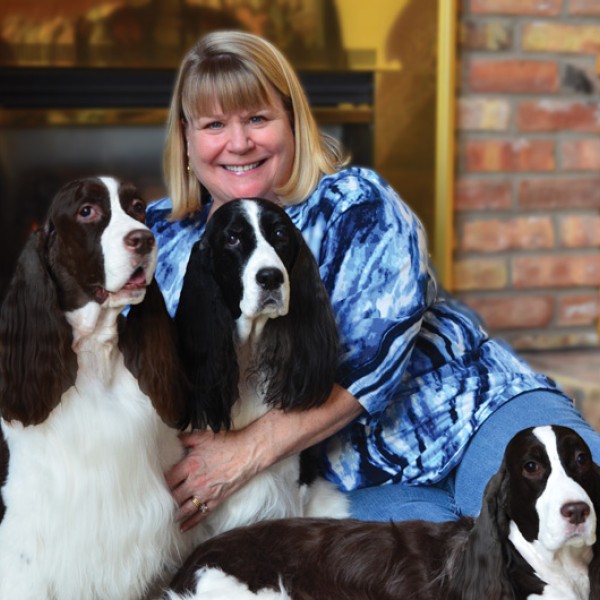 Liz Westring posing with her 3 dogs