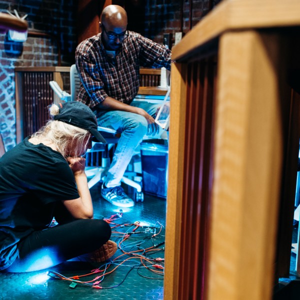 students look down as they test lights