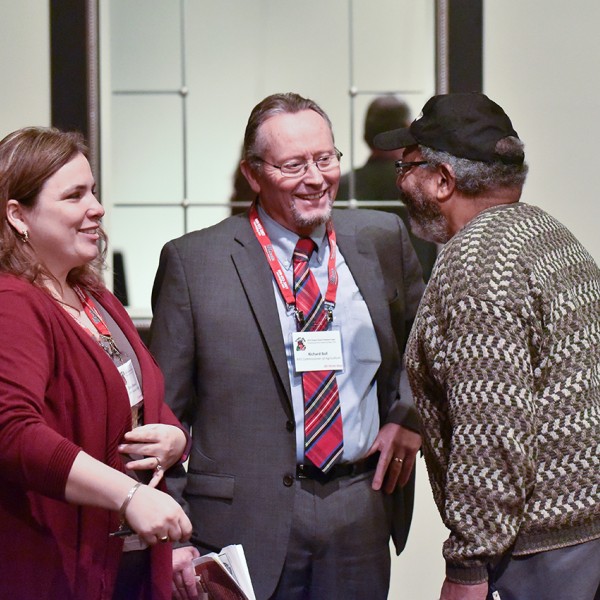 3 people talking and laughing