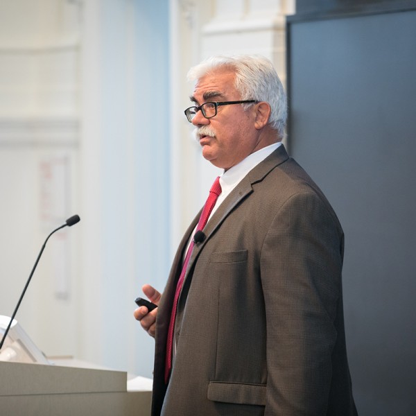 man speaking at podium