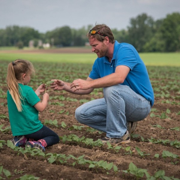 Christian Yunker with is daughter at Cy Farms in Elba, New York