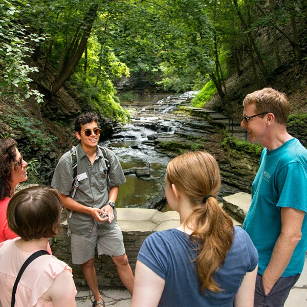 family and steward talk near gorge