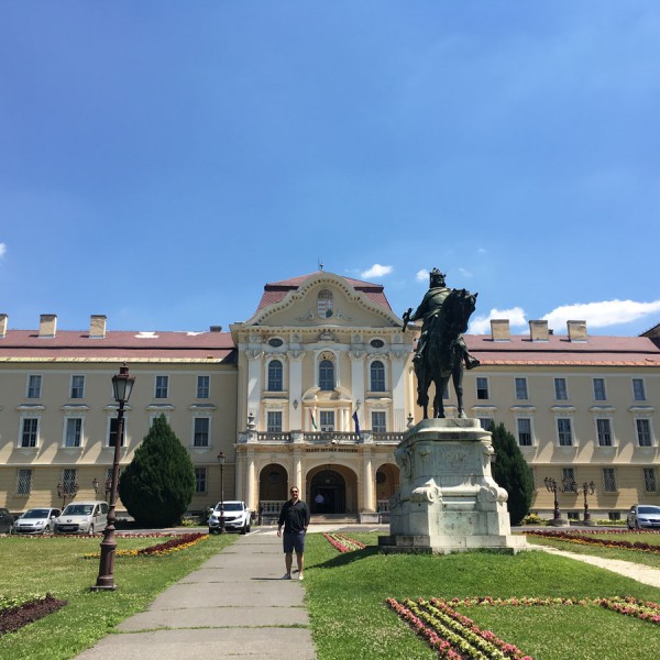 Mark Sarvary stands in the SZIU entrance way