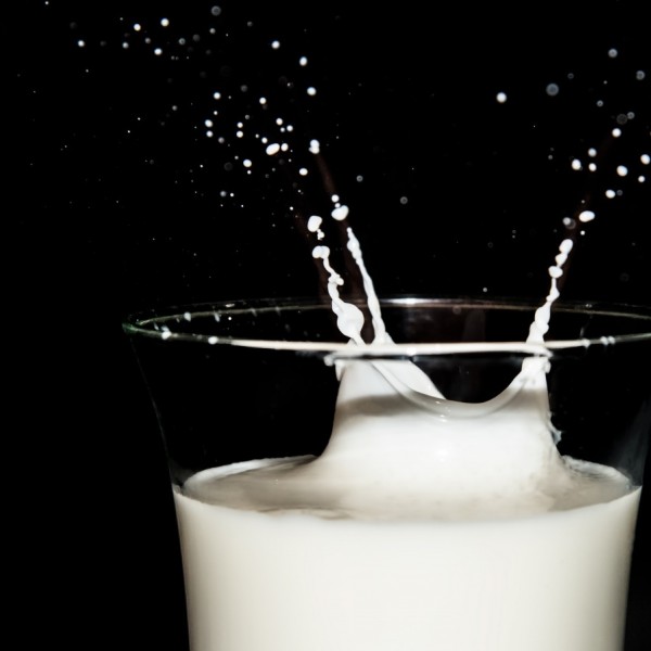 a glass of milk with splash