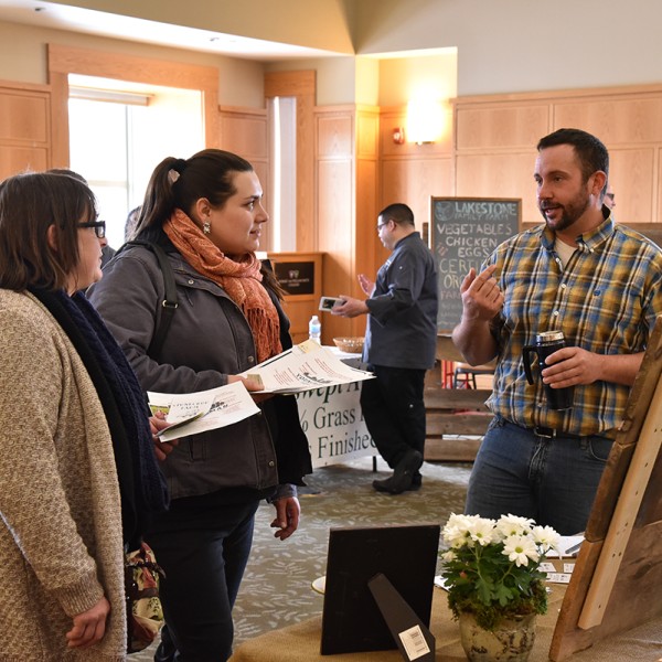 Paul Batz speaks with potential customers at the 2017 Meat & Greet Farmer and Chef Fair