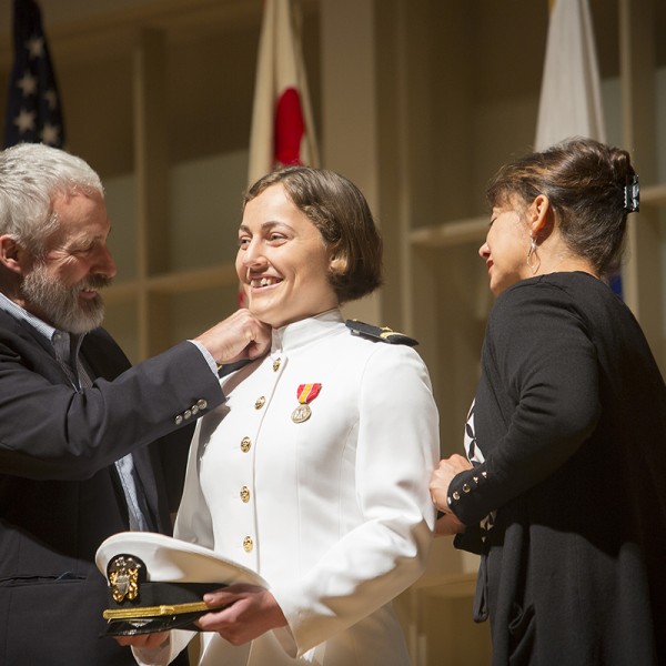 Ensign Courtney McGranaghan with her parents