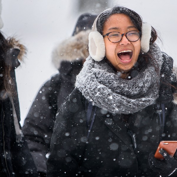 Students walking through snowy quad