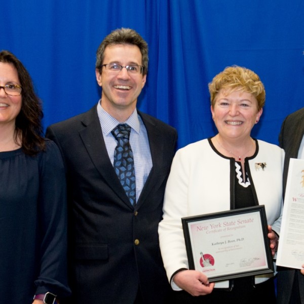 Dean Boor accepting her award on stage