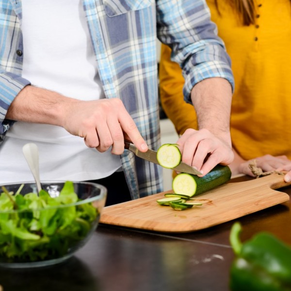 People preparing vegetables in a kitchen