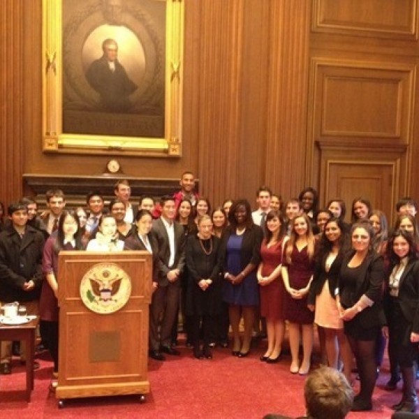 A group photo of people in professional clothing